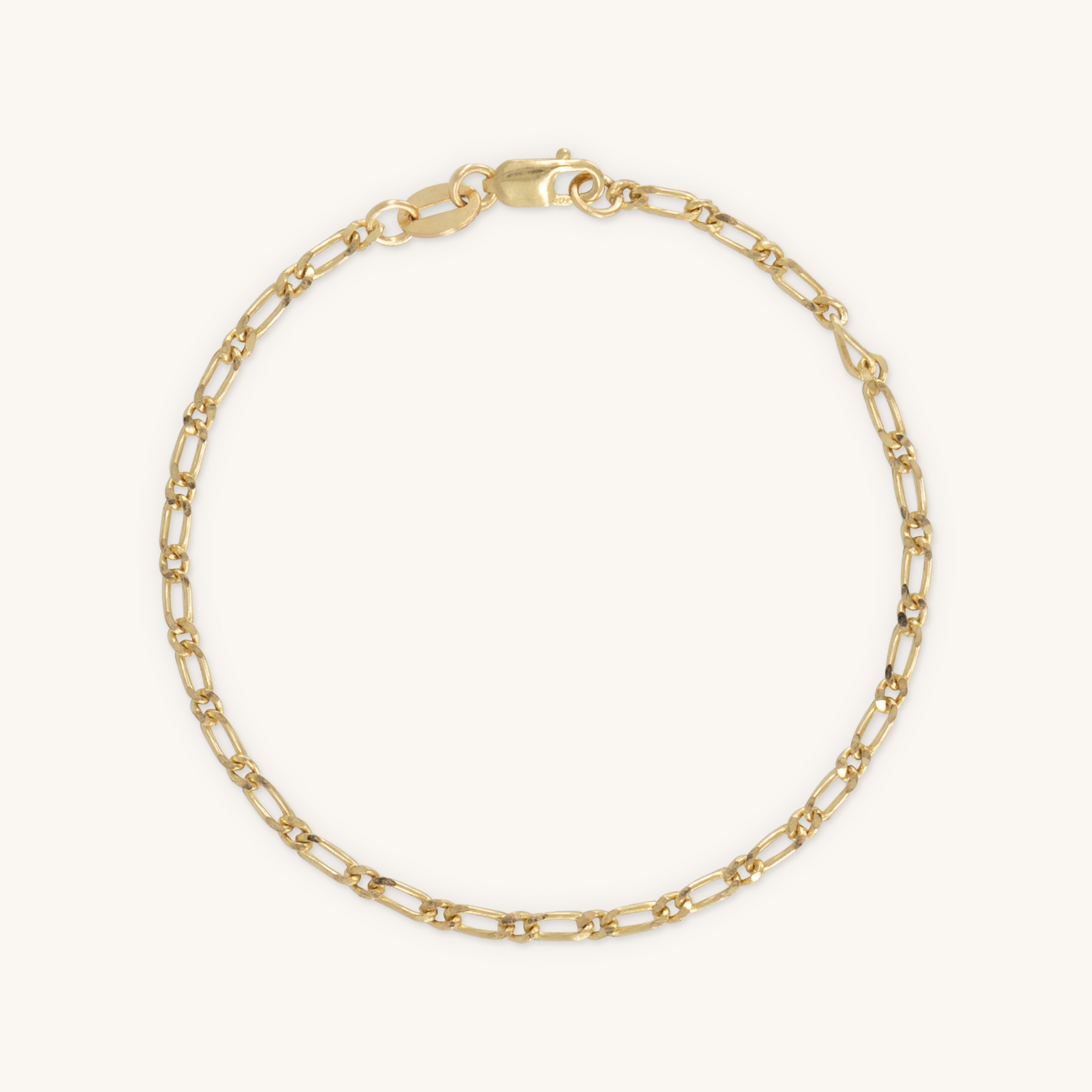 Gold chain bracelet displayed on a clean white background, highlighting its elegant design and shine.