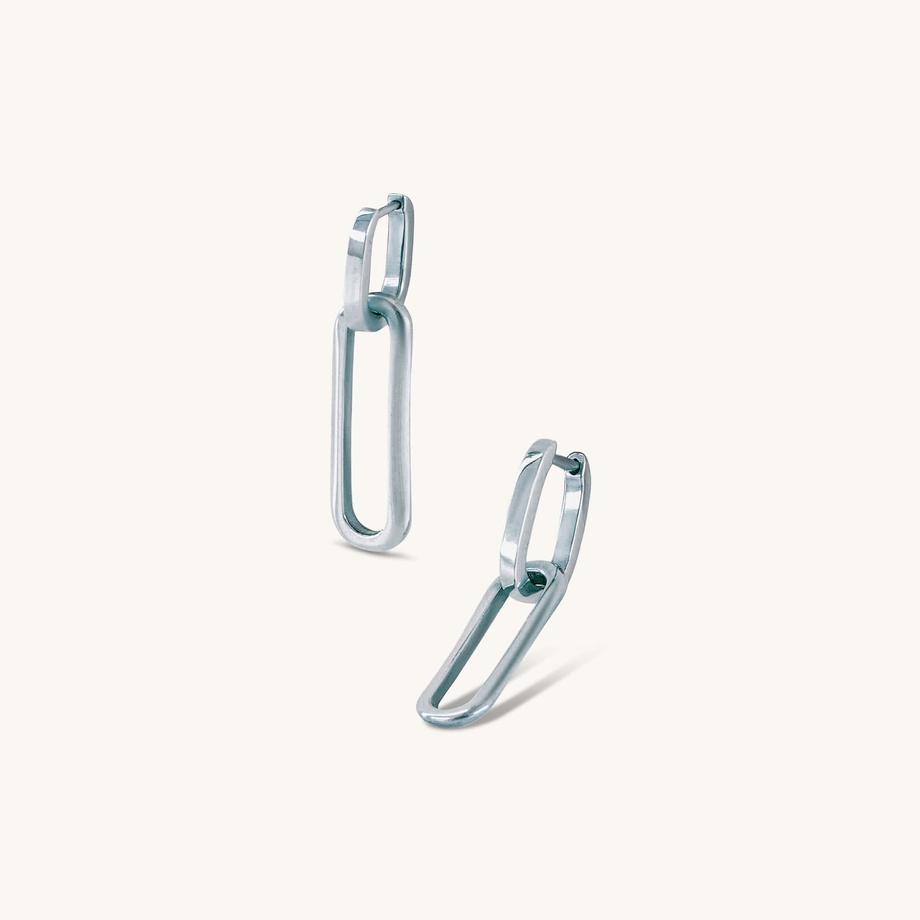 Pair of silver hoop earrings on a white background