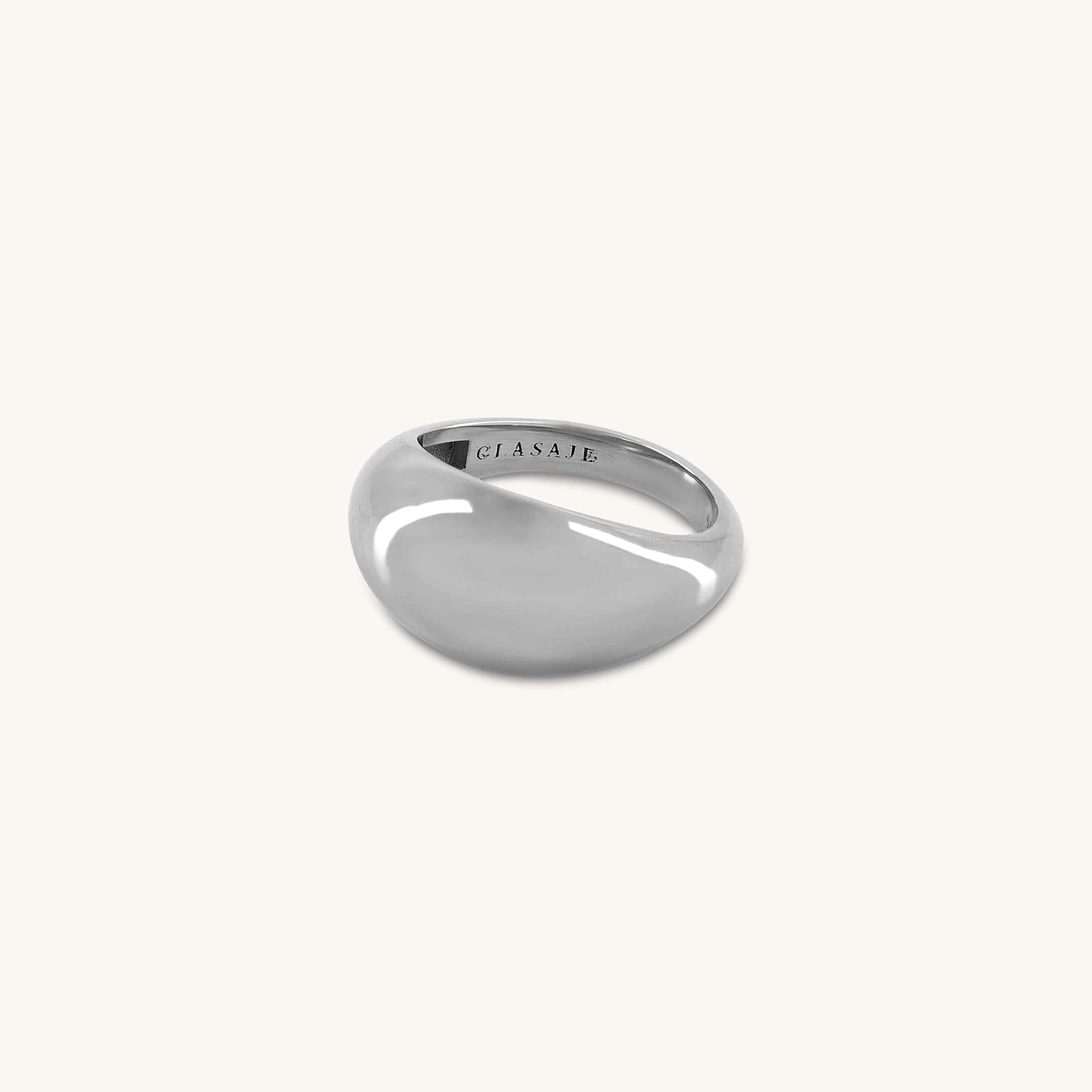 Silver ring with 'GLASAJE' engraving on a white background