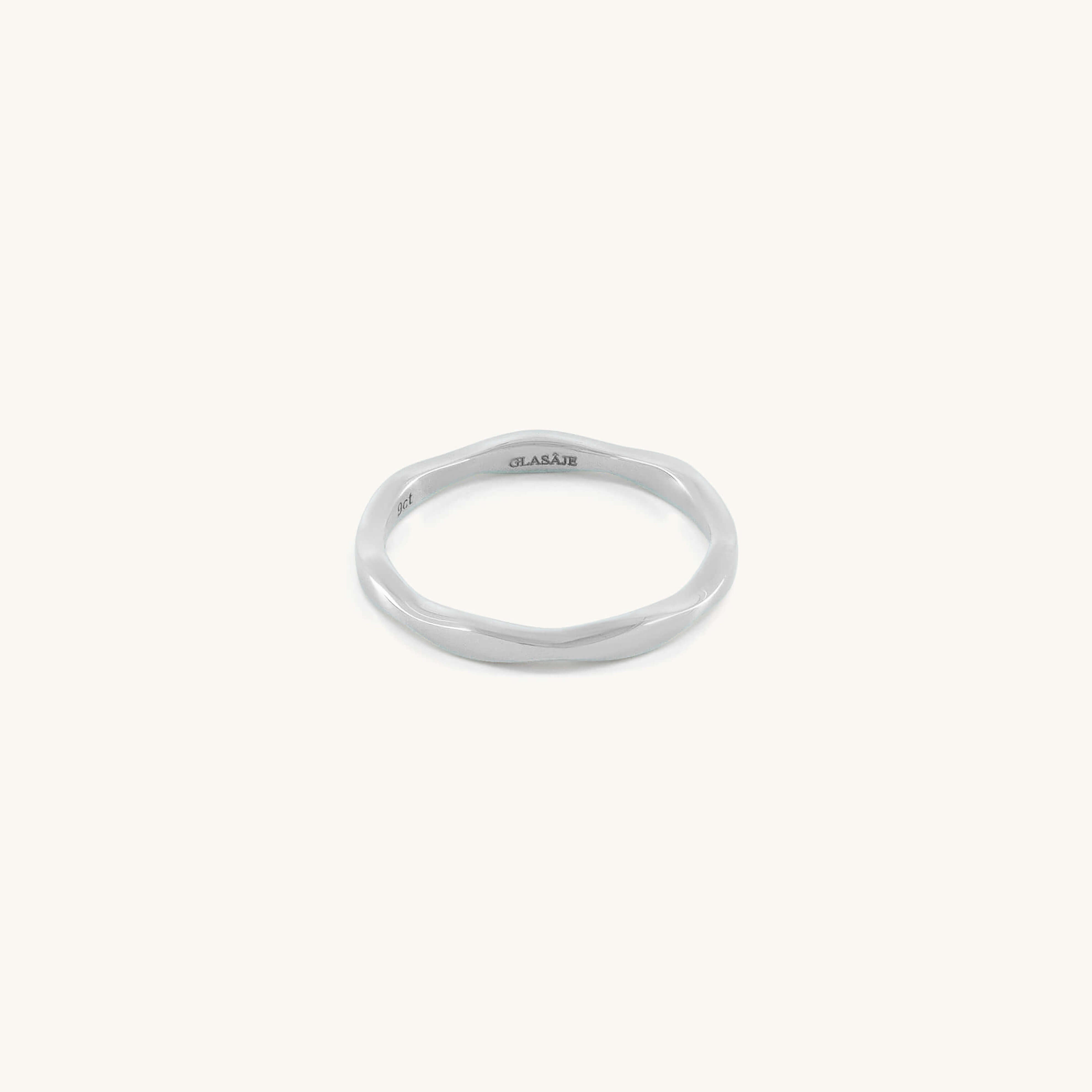 Silver ring with 'GLASAJE' branding on a white background