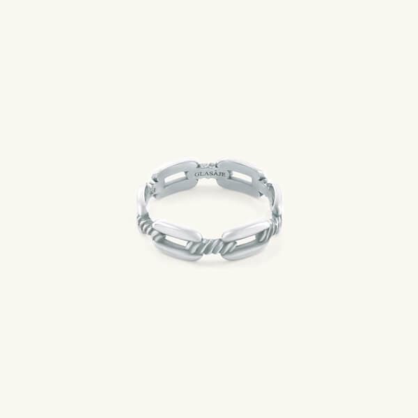 Silver ring with a textured band on a white background